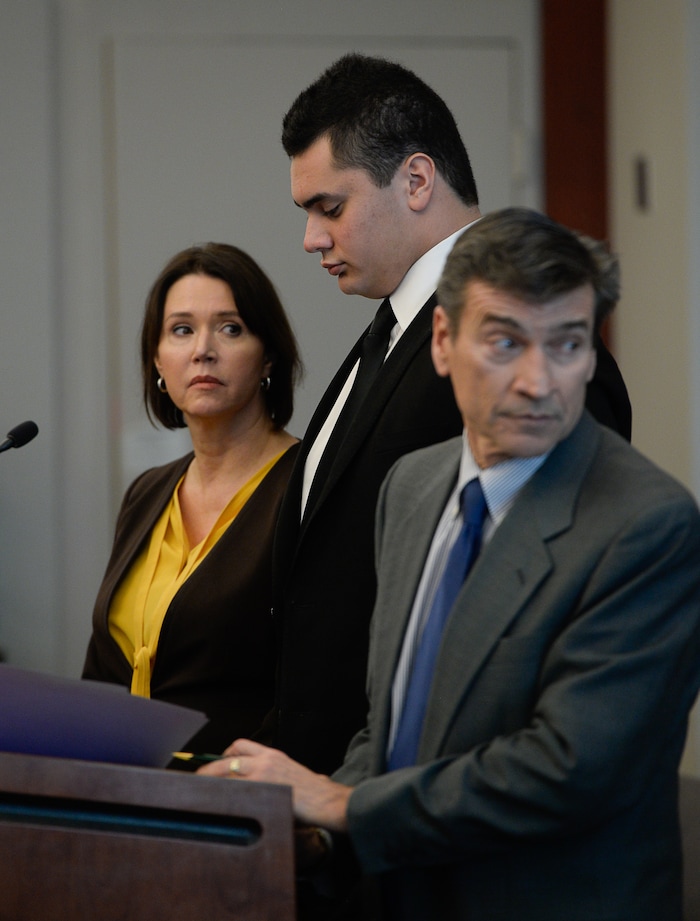 (Francisco Kjolseth  |  The Salt Lake Tribune)  Former Brighton High and University of Southern California linebacker Osa Masina, center, is joined by his defense attorney's Greg and Rebecca Skordas during his sentencing for sexual battery at the Matheson Courthouse in Salt Lake City on Tuesday, Dec. 5, 2017. Masina was sentenced to 365 days in jail, followed by two years on probation.