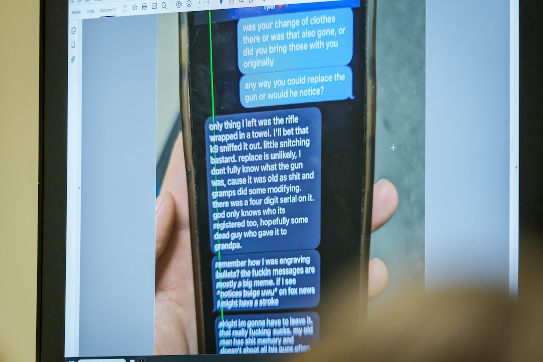 (Spenser Heaps | Pool) A photograph which prosecutors say shows a text message exchange between Tyler Robinson, who is accused in the fatal shooting of Charlie Kirk, and Robinson’s roommate and romantic partner Lance Twiggs, is shown during a preliminary hearing at the Fourth District Courthouse in Provo, Thursday, July 9, 2026.