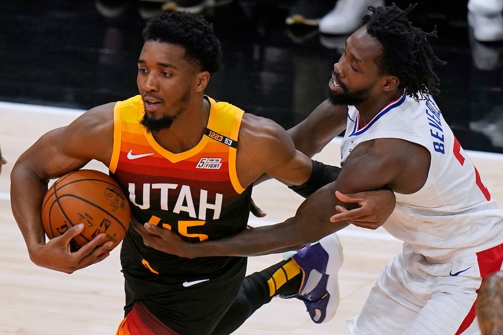 Los Angeles Clippers guard Patrick Beverley, right, fouls Utah Jazz guard Donovan Mitchell during the first half of Game 5 of a second-round NBA basketball playoff series Wednesday, June 16, 2021, in Salt Lake City. (AP Photo/Rick Bowmer)