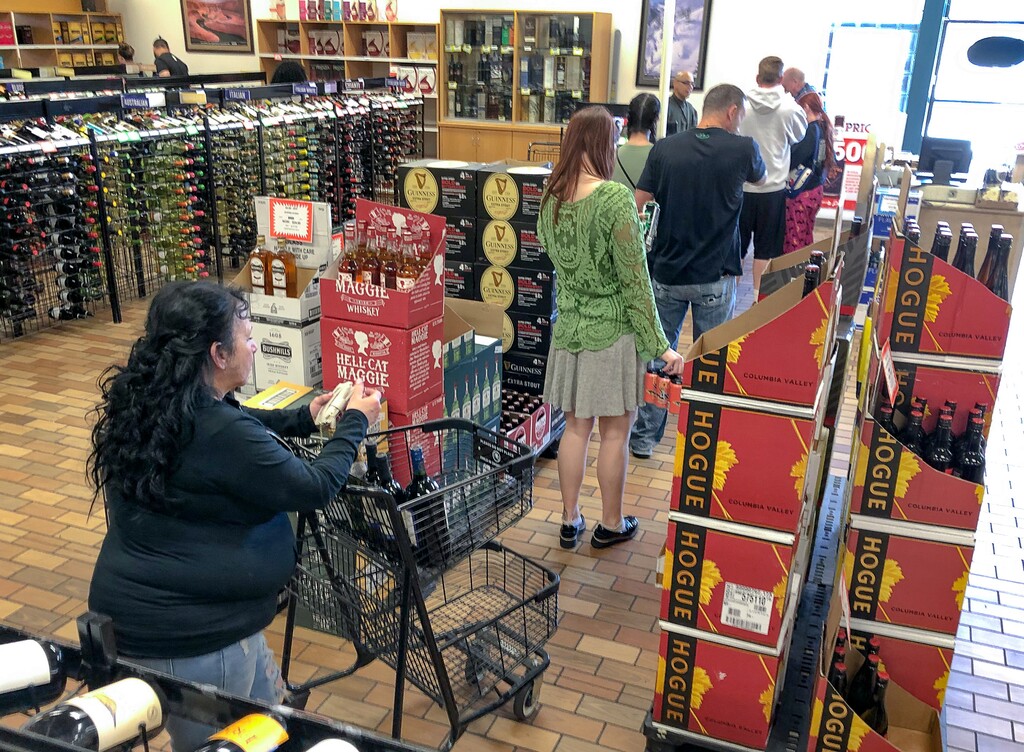 (Francisco Kjolseth  |  The Salt Lake Tribune) The state-run liquor store in Murray has faced some empty shelves and long lines, but staffers continue to restock products on Tuesday, March 17, 2020.