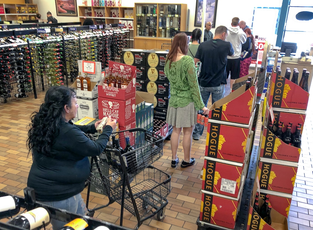 (Francisco Kjolseth  |  The Salt Lake Tribune) The state-run liquor store in Murray has faced some empty shelves and long lines but staff continue to restock product on Tuesday, March 17, 2020. Before Utahns hunker down during the coronavirus, they are stocking up on wine, beer and spirits at state-run liquor stores. Last weekend, the state sold $8 million in alcohol — a total that resembles the day before Thanksgiving or Christmas.