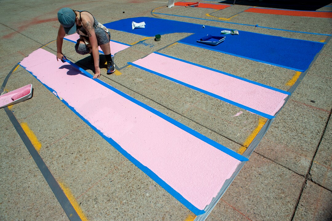 (Rick Egan  |  The Salt Lake Tribune)    Artist, Emma Lamae, works on the Black Lives Matter mural, on the south side of Salt Lake City Hall on Tuesday, Aug. 4, 2020.