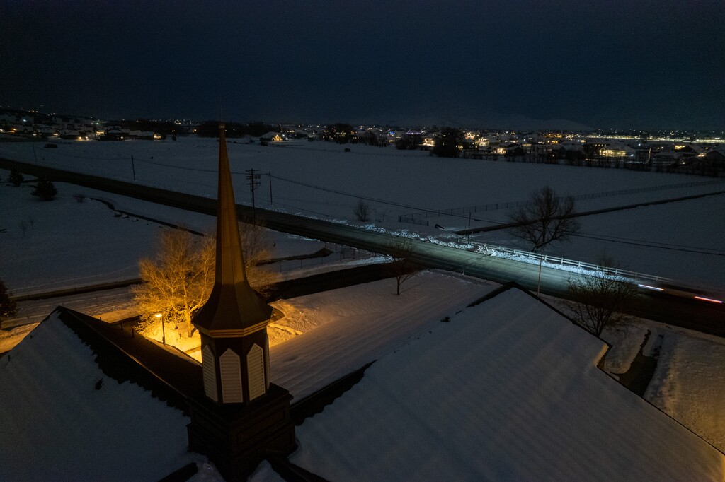 (Trent Nelson  |  The Salt Lake Tribune) A large empty field is the site of the announced Church of Jesus Christ of Latter-day Saints temple in Heber on Thursday, Jan. 26, 2023. In the foreground is a Latter-day Saint meetinghouse.