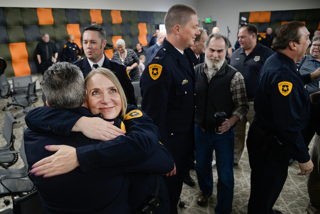 (Francisco Kjolseth  |  The Salt Lake Tribune)  Salt Lake City Airport Police officer Camille Goodwin hugs Deputy Chief Craig Vargo following a ceremony to retire their patch and badge as they are subsumed into the Salt Lake City Police Department on Tuesday, Feb. 26, 2019. 