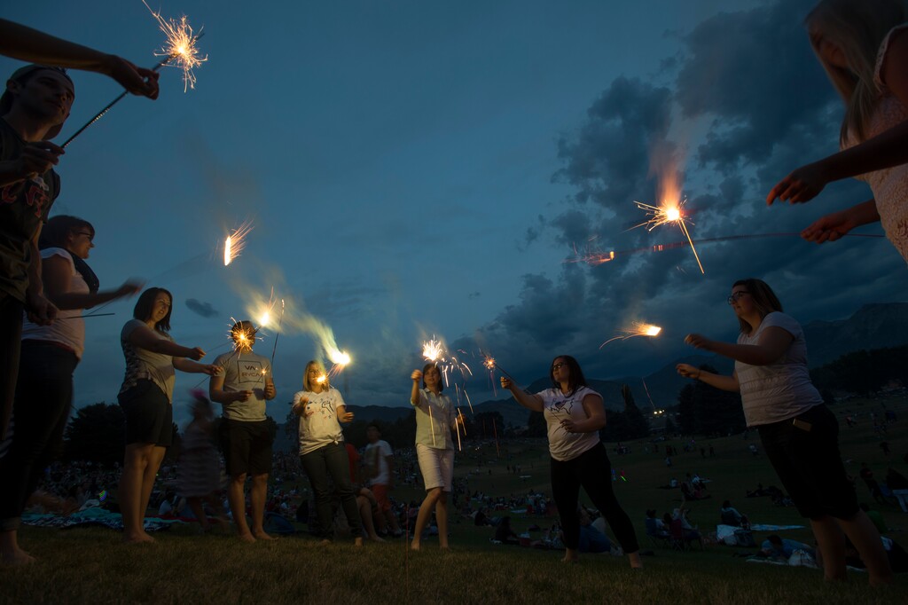 (Rick Egan  |  The Salt Lake Tribune) July 4 revelers plays with sparklers before the Sugarhouse fireworks, Saturday, July 4, 2015.