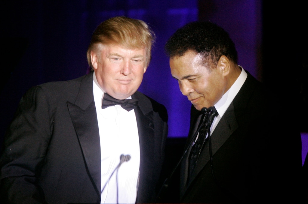 FILE - In this March 24, 2007, file photo, Donald Trump, left, accepts his Muhammad Ali award from Ali at Muhammad Ali's Celebrity Fight Night XIII in Phoenix, Ariz. Ali is criticizing Republican presidential front-runner Trump's proposal to ban Muslims from entering the United States, and calling on Muslims "to stand up to those who use Islam to advance their own personal agenda." (AP Photo/Jeff Chiu, File)