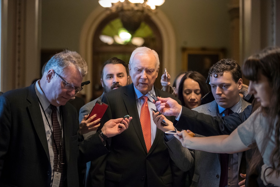 (J. Scott Applewhite  |  AP Photo)  Reporters ask questions of Sen. Orrin Hatch, R-Utah, chairman of the tax-writing Finance Committee, as he walks to meet with Senate Majority Leader Mitch McConnell, R-Ky., on the GOP effort to overhaul the tax code, on Capitol Hill in Washington, Friday, Dec. 1, 2017.