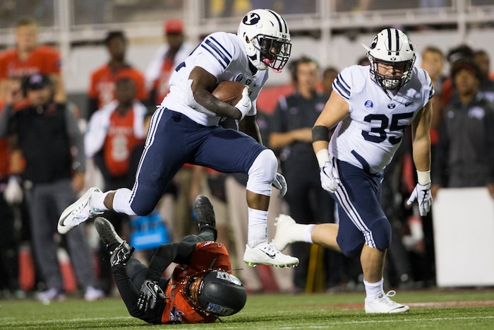 Brigham Young Cougars running back Squally Canada (22) runs the ball against the UNLV Rebels during an NCAA college football game Friday, Nov. 10, 2017, in Las Vegas. (Erik Verduzco/Las Vegas Review-Journal via AP)