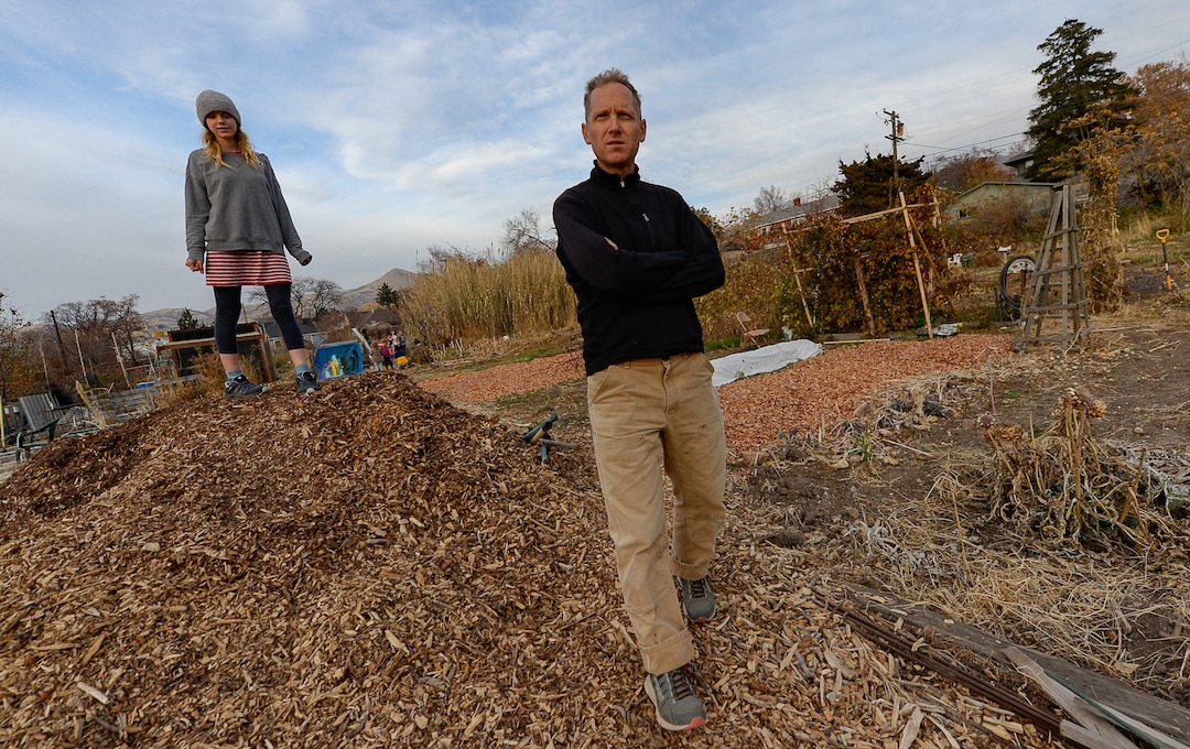 (Francisco Kjolseth  |  The Salt Lake Tribune)  Jeff Porucznik and his daughter Zoey, 13, walk around the community garden where families have grown fruits and vegetables for years. The Poruczniks grow on one of the 42 plots at the garden, which has operated on church land for 43 years.