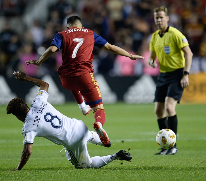(Francisco Kjolseth  |  The Salt Lake Tribune)  Los Angeles Galaxy midfielder Jonathan dos Santos (8) battles Real Salt Lake forward Jefferson Savarino (7) during the first half of the MLS soccer match Saturday, Sept. 1, 2018, in Sandy at Rio Tinto Stadium.
