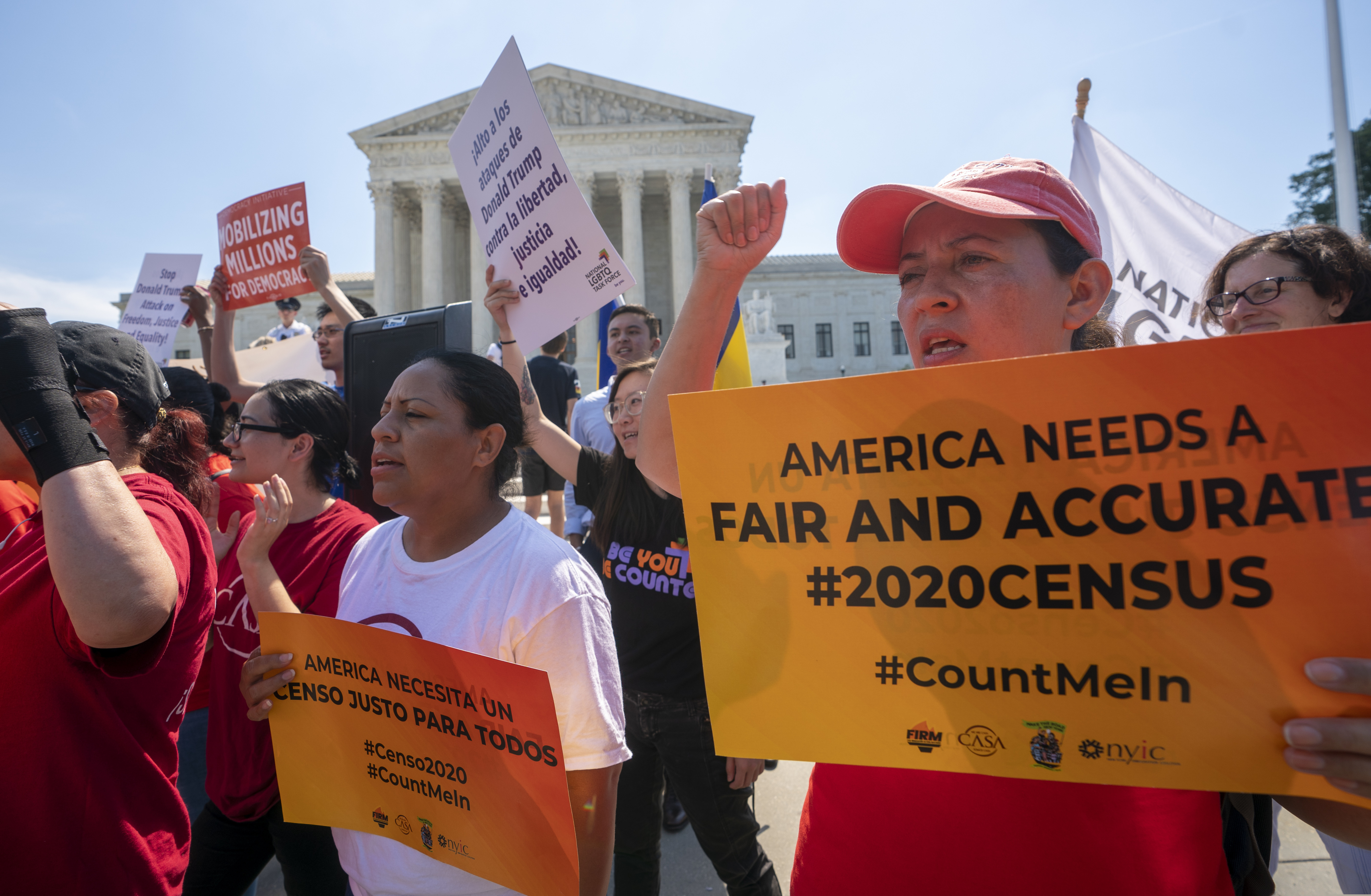 (J. Scott Applewhite | AP Photo) In this June 27, 2019 photo, Demonstrators gather at the Supreme Court as the justices finish the term with key decisions on gerrymandering and a census case involving an attempt by the Trump administration to ask everyone about their citizenship status in the 2020 census, on Capitol Hill in Washington. The Justice Department said Tuesday that the 2020 Census is moving ahead without a question about citizenship.
