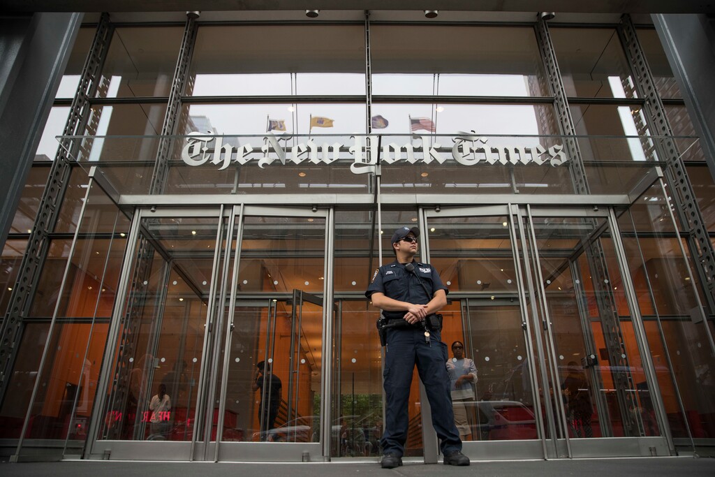 (Mary Altaffer | AP file photo)

In this June 28, 2018, photo, a police officer stands guard outside The New York Times building in New York.