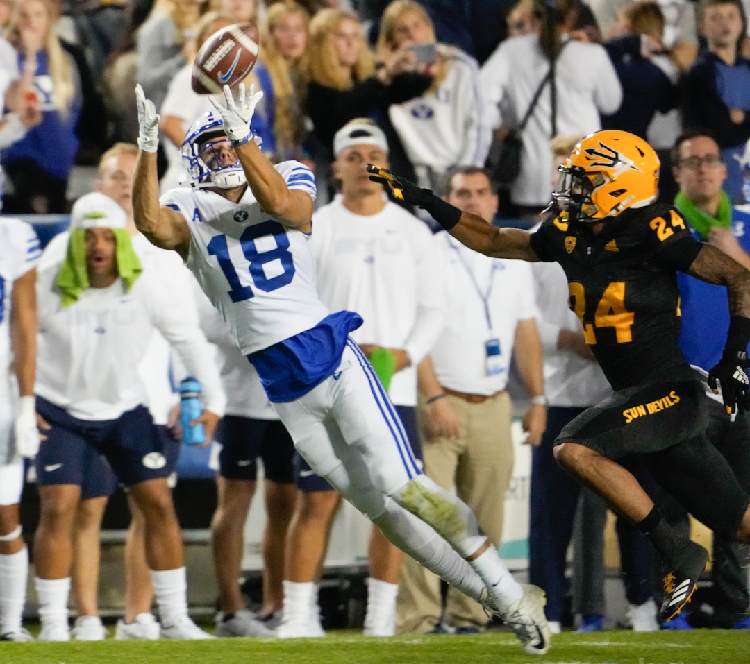 (Francisco Kjolseth | The Salt Lake Tribune) Brigham Young Cougars wide receiver Gunner Romney (18) stretches out for a reception in football action between the Brigham Young Cougars and the Arizona State Sun Devils at LaVell Edwards Stadium in Provo, on Saturday, Sept. 18, 2021.
