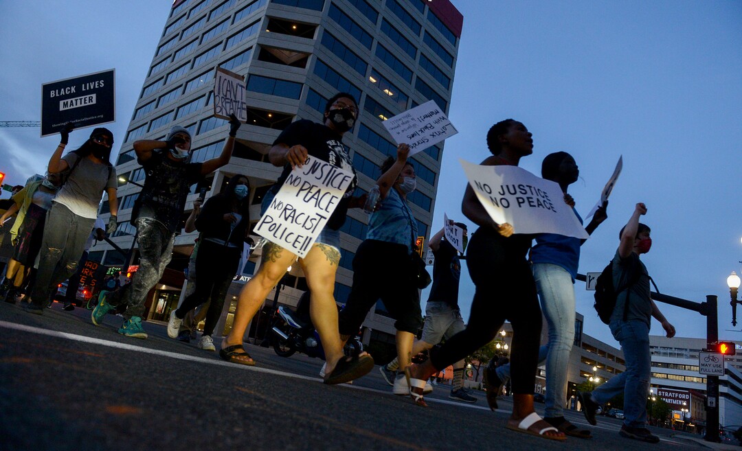 (Leah Hogsten  |  The Salt Lake Tribune) Protesters walk down State Street against police brutality in Salt Lake City on Monday, June 1, 2020.