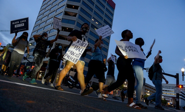(Leah Hogsten  |  The Salt Lake Tribune) Protesters walk down State Street against police brutality in Salt Lake City on Monday, June 1, 2020.
