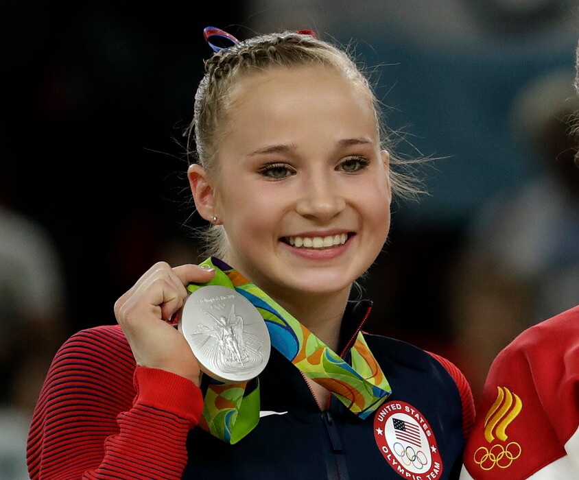FILE - In this Aug. 14, 2016, file photo, United States' Madison Kocian, displays her silver medal for the uneven bars during the artistic gymnastics women's apparatus final at the 2016 Summer Olympics in Rio de Janeiro, Brazil. Olympic gold-medal winning gymnasts Kyla Ross and Madison Kocian say they are among the sexual abuse victims of disgraced former USA Gymnastics doctor Larry Nassar. Kocian, a member of the “Final Five” that stormed to gold at the 2016 Olympics, says she was in denial for a long time but opted to come forward after watching so many of her former teammates detail their abuse at the hands of Nassar. (AP Photo/Dmitri Lovetsky, File)