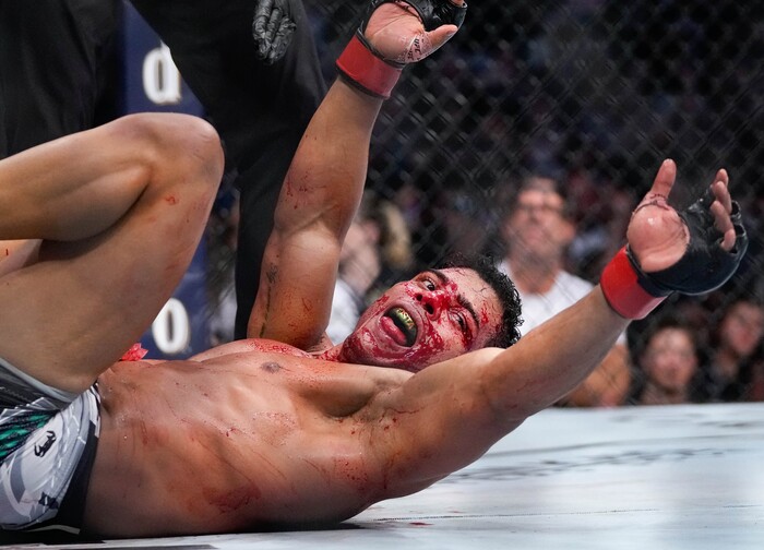 (Francisco Kjolseth | The Salt Lake Tribune) No. 6 ranked middleweight Paulo Costa of Brazil, right, wins a bloody round with former middleweight champion Luke Rockhold of the United States during their UFC 278 mixed martial arts bout in the octagon at Vivint Arena in Salt Lake City on Saturday, Aug. 20, 2022. 