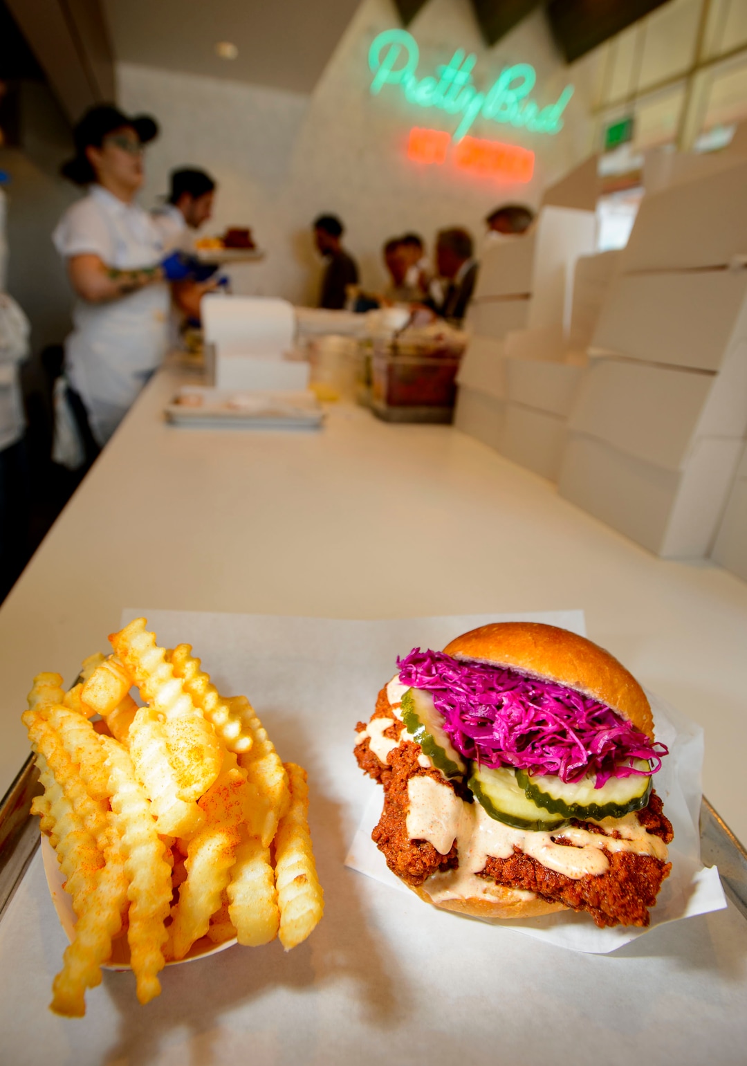 (Steve Griffin  |  The Salt Lake Tribune)  The chicken sandwich combo at Pretty Bird, a new Nashville-style hot chicken restaurant on Regent Street, in Salt Lake City Monday April 23, 2018.