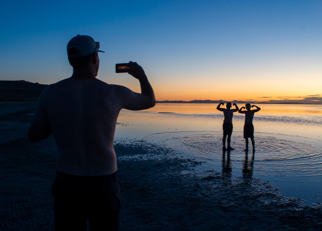 (Rick Egan  |  The Salt Lake Tribune)    Adam Stevenson and Sam Rushton strike a pose as Jim Platt, snaps a photo of them after floating in the Great Salt Lake. Wednesday, Sept. 18, 2019.