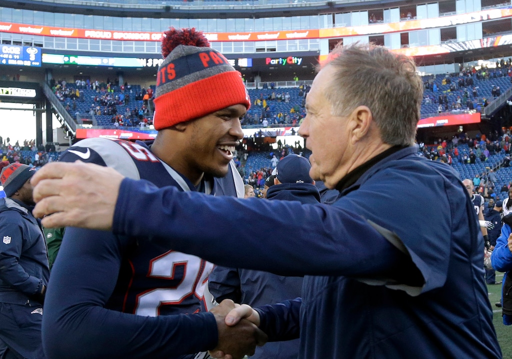 New England Patriots head coach Bill Belichick, right, speaks to defensive back Eric Rowe at midfield following an NFL football game against the New York Jets, Saturday, Dec. 24, 2016, in Foxborough, Mass. (AP Photo/Elise Amendola)