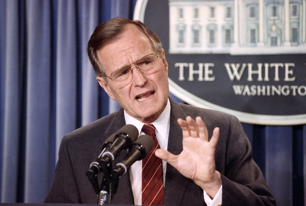 FILE - In this March 13, 1990 file photo, President George H.W. Bush speaks during a news conference in the White House briefing room in Washington. (AP Photo/Barry Thumma, File)