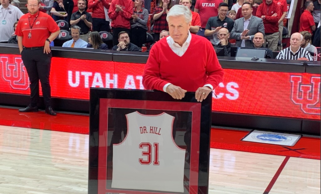 (Josh Newman | The Salt Lake Tribune) Former University of Utah athletic director Chris Hill was honored at halftime of Saturday's basketball game against Cal with a banner raised to the Huntsman Center rafters.