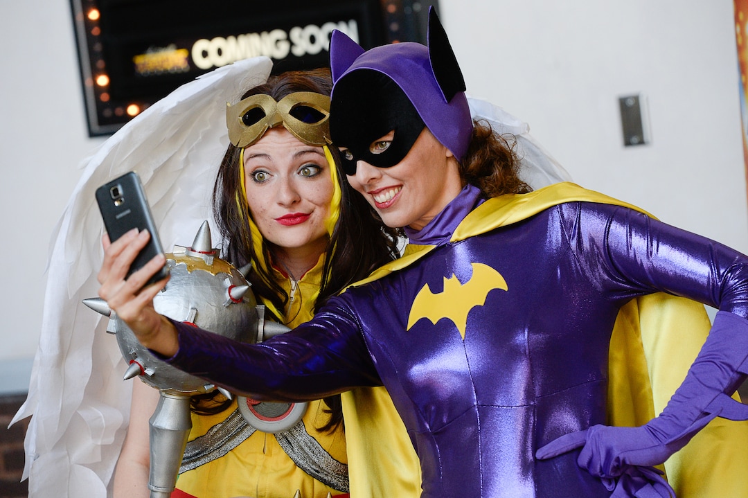 (Francisco Kjolseth  |  The Salt Lake Tribune)  Mother and daughter superhero duo Ruth Barnum, left, and Bekcy Barnum join the fun for FanX's twice-annual "press conference," drawing cosplayers to Megaplex Jordan Commons in Sandy on Wed. June 12, 2019, for the announcement of the event's celebrity visitors.