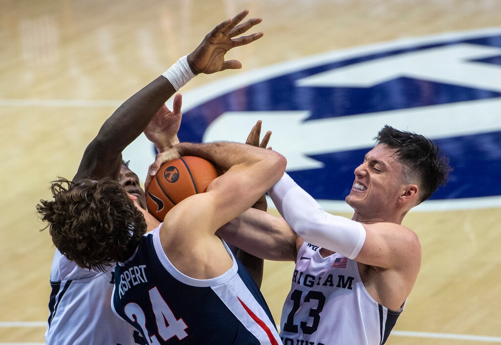 (Rick Egan | The Salt Lake Tribune)  Brigham Young Cougars guard Brandon Averette (4),and Alex Barcello (13), double-team Gonzaga Bulldogs forward Corey Kispert (24), in West Coast Conference Basketball action between the Brigham Young Cougars and the Gonzaga Bulldogs at the Marriott Center in Provo, on Monday, Feb. 8, 2021.