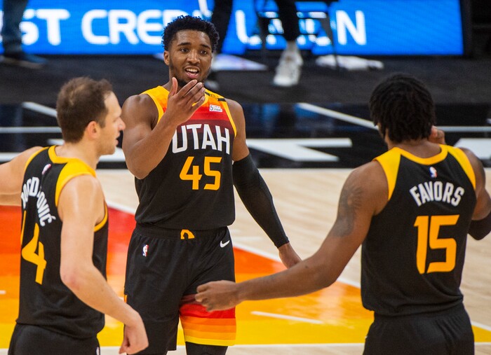 (Rick Egan | The Salt Lake Tribune) Utah Jazz guard Donovan Mitchell (45) forward Bojan Bogdanovic (44) Jazz center Derrick Favors (15), react as the Jazz extend their lead, in NBA action between the Utah Jazz and the Atlanta Hawks at Vivint Arena, on Friday, Jan. 15, 2021.