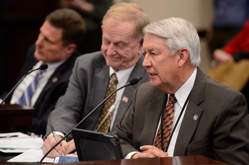 (Trent Nelson | The Salt Lake Tribune)
John Valentine, chairman of the Utah State Tax Commission, speaks as the Senate Health and Human Services committee debates SB96, a bill replacing Proposition 3, at the Utah Capitol in Salt Lake City on Tuesday, Jan. 29, 2019. At left are Rep. Jim Dunnigan, R-Taylorsville, and Sen. Allen Christensen, R-North Ogden.