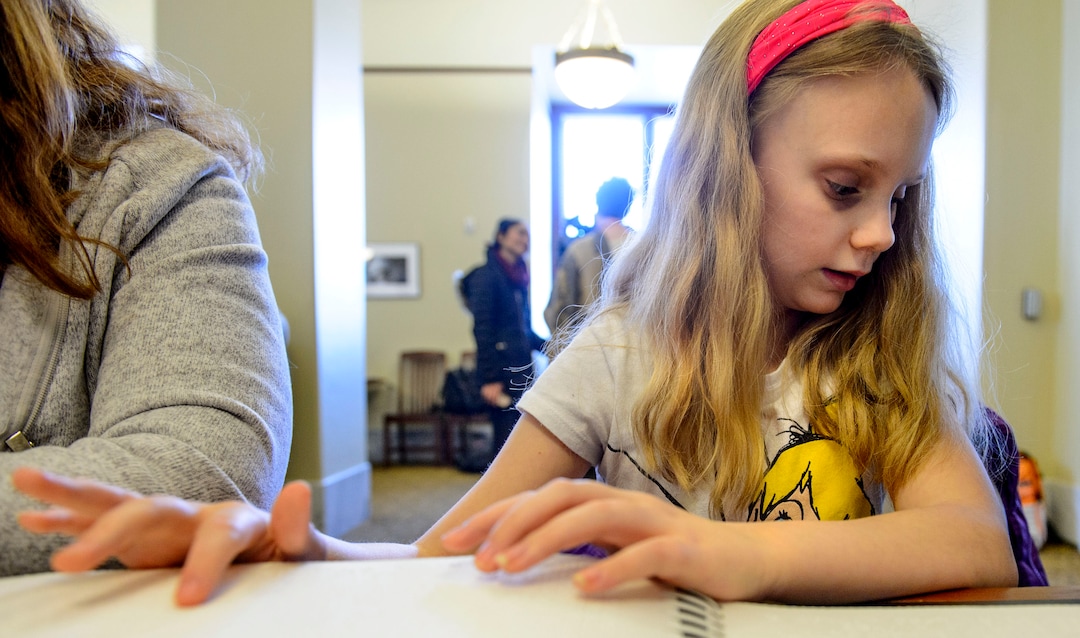 (Steve Griffin  |  The Salt Lake Tribune)  Ellie Mckinlay works on her Braille literacy during the Utah Schools for the Deaf and Blind "Kids in the Classroom at the Capitol day" in Salt Lake City Thursday February 8, 2018.