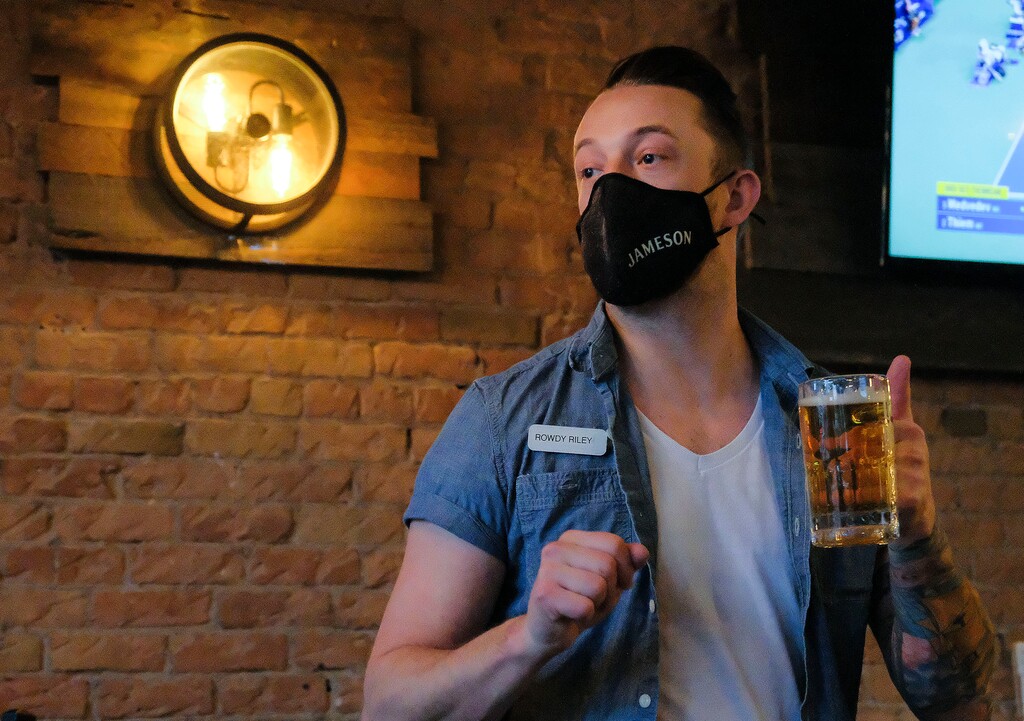(Leah Hogsten | The Salt Lake Tribune) "I won't feel 100% safe until this all of this is over," said Riley Swain, 32, serving patrons at Harp and Hound, a pub in Ogden on Monday, but he said he's OK with letting those 75 and older get the coronavirus vaccine before he does. Gov. Gary Herbert's COVID-19 Unified Command on Monday, Dec. 28, 2020, adopted recommendations for Phase 2 of Utah's COVID-19 vaccine rollout, which includes removing food and restaurant workers from the list of people eligible to receive the vaccine early.