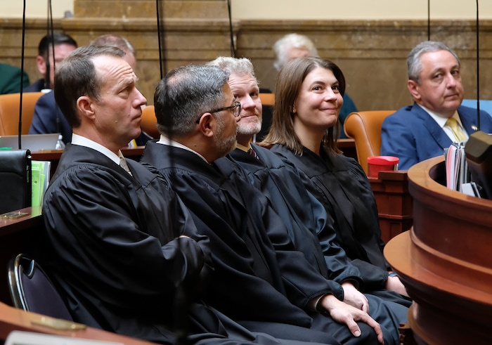 (Francisco Kjolseth | The Salt Lake Tribune) Newest Supreme Court justice Paige Petersen smiles at court staff gathered in the gallery of the House of Representatives as she and fellow justices Thomas R. Lee, Constandinos Himonas, and John A. Pearce, from left, listen to Chief Justice Matthew B. Durrant give the state of the judiciary on the first day of the 2018 legislative session at the Utah Capitol on Monday, Jan. 22, 2018.