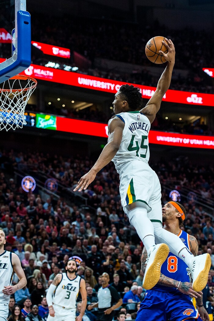 (Chris Detrick  |  The Salt Lake Tribune)  Utah Jazz guard Donovan Mitchell (45) goes up for a dunk past New York Knicks forward Michael Beasley (8) during the game at Vivint Smart Home Arena Friday, January 19, 2018.  Utah Jazz guard Donovan Mitchell (45) missed the dunk. 