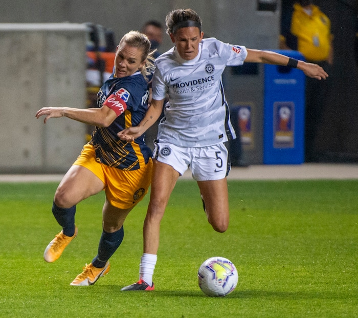 (Rick Egan | The Salt Lake Tribune) Utah Royals FC forward Amy Rodriguez (8) goes for the ball along with Portland Thorns FC defender Emily Menges (5), in soccer action between Utah Royals FC and Portland Thorns FC at Rio Tinto Stadium, on Saturday, Oct. 3, 2020.