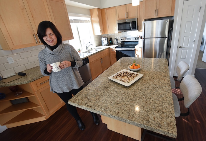 (Francisco Kjolseth  |  The Salt Lake Tribune)  National blogger Courtney Carver has made a living out of simplifying her life and has a new book "Soulful Simplicity." It started a few years ago when she started a minimalist fashion challenge on her blog called Project 333, dressing with just 33 items or less for 3 months. The project went viral and for her it has extended beyond the closet, by also taking control of her health and expenses. Along with her husband and their two cats they share a 900-square-foot living space in Salt Lake and have decided not to rush into decorating the walls or the apartment.