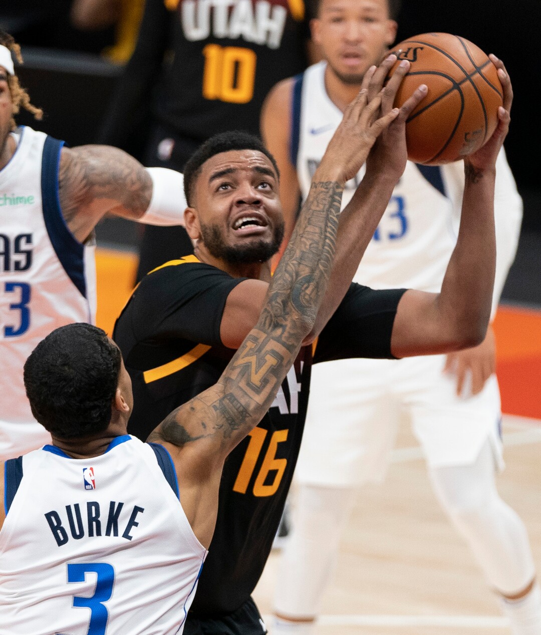 (Rick Egan | The Salt Lake Tribune) Dallas Mavericks guard Trey Burke (3) guards Utah Jazz forward Juwan Morgan (16), in NBA action between the Utah Jazz and the Dallas Mavericks at Vivint Arena, on Friday, Jan. 29, 2021.