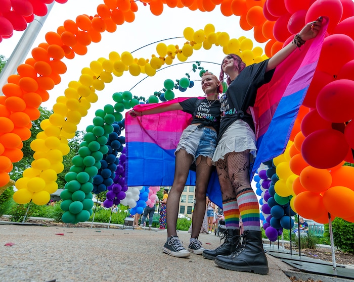 (Leah Hogsten | The Salt Lake Tribune)  Hannah Reed and Hailey Heaps post for photos under the giant balloon rainbow during the Utah Pride Festival at Washington Square, Saturday, June 4, 2022. 