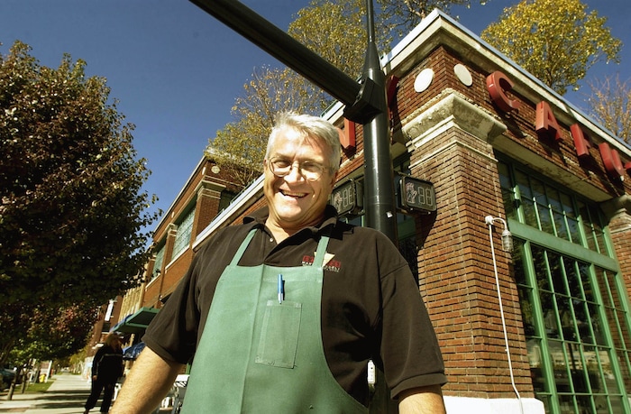 (Paul Fraughton | Tribune file photo) Tony Caputo stands outside his deli in 2002.