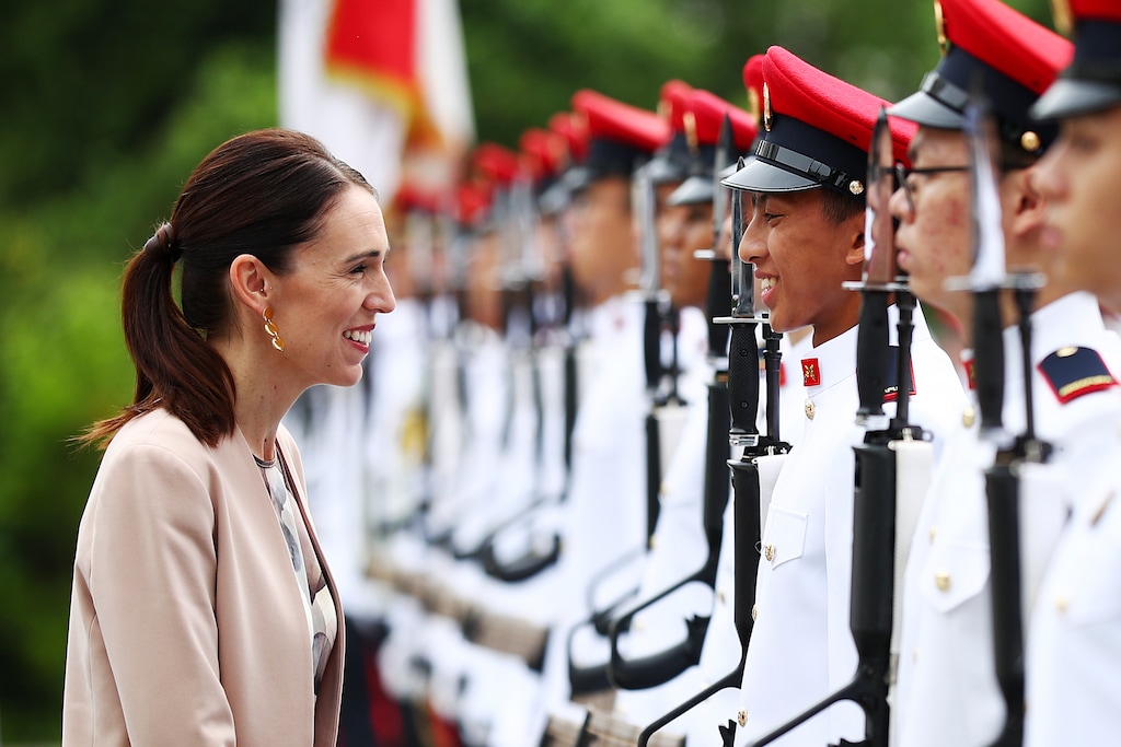 (Yong Teck Lim  |  AP)  New Zealand's Prime Minister Jacinda Ardern speaks with a member of the honor guard during a welcome ceremony at the Istana or presidential palace in Singapore, Friday, May 17, 2019.