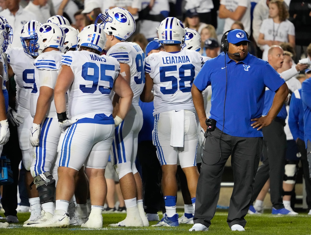 (Francisco Kjolseth | The Salt Lake Tribune) Brigham Young Cougars head coach Kalani Sitake makes sure one of his players is ok as the medical team looks after defensive lineman Atunaisa Mahe (62) who takes a moment to get up after a hard hit during their game against the Arizona State Sun Devils at LaVell Edwards Stadium in Provo, on Saturday, Sept. 18, 2021.