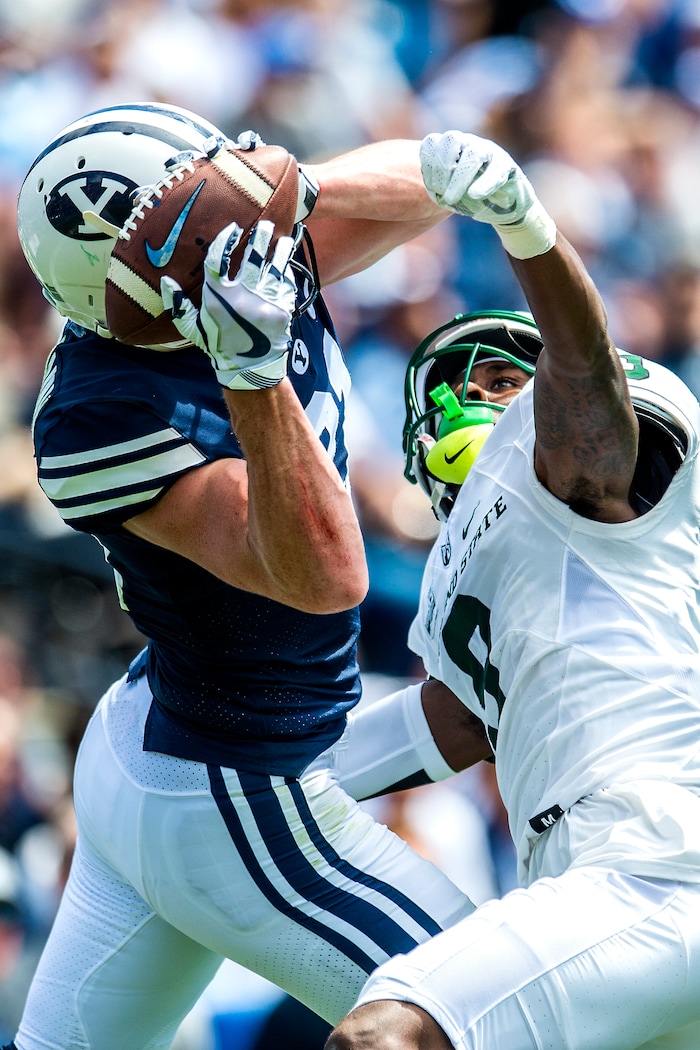 (Chris Detrick  |  The Salt Lake Tribune)  Brigham Young Cougars wide receiver Talon Shumway (21) makes a catch over Portland State Vikings cornerback Chris Seisay (9) during the game at LaVell Edwards Stadium Saturday, August 26, 2017.