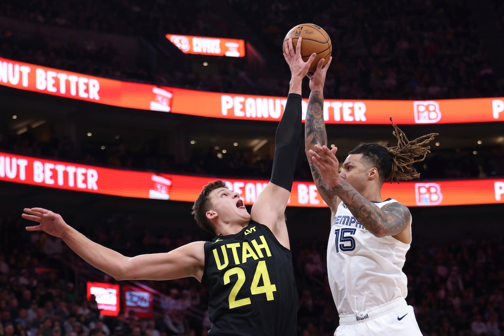 Utah Jazz center Walker Kessler (24) blocks the shot of Memphis Grizzlies forward Brandon Clarke (15) during the first half of an NBA basketball game, Wednesday, Oct. 23, 2024, in Salt Lake City. (AP Photo/Rob Gray)