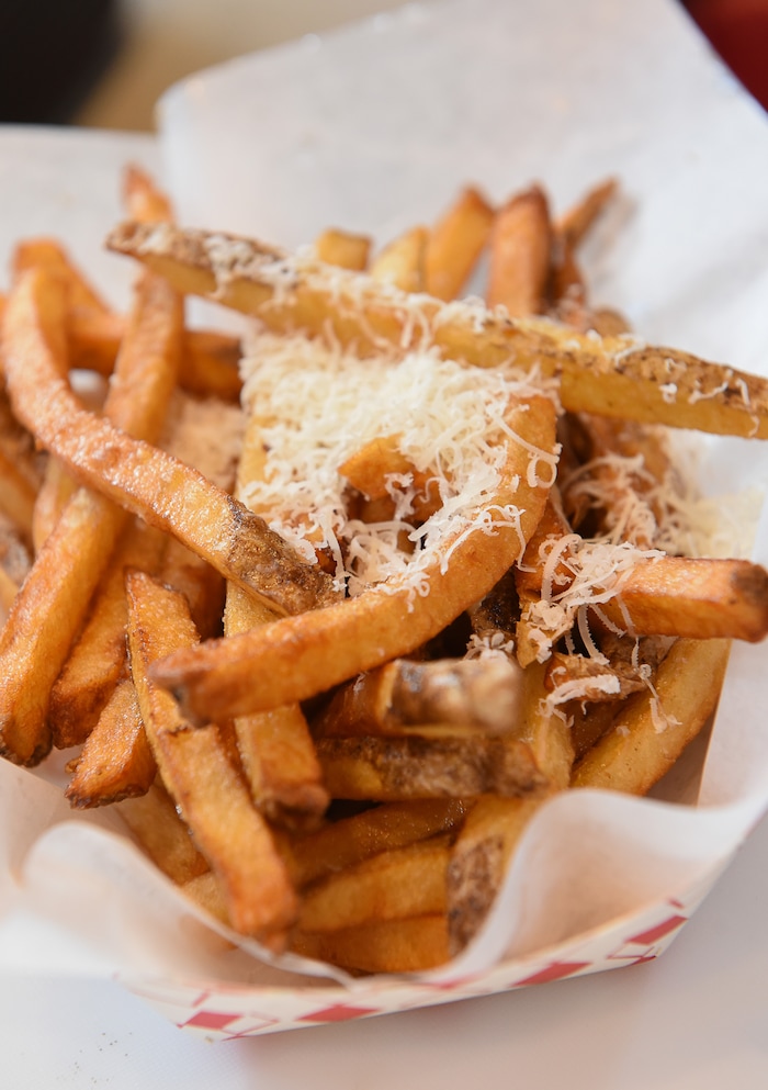 (Francisco Kjolseth | The Salt Lake Tribune) Special Courses, a military-themed restaurant in the dining terrace at The Shops at South Town in Sandy, specializes in burgers and fries including the "Semper Fries," with parmesan cheese. Staff Sgt. James Veylupek, the owner, got help launching the eatery after winning Taste for the Space in May 2017.