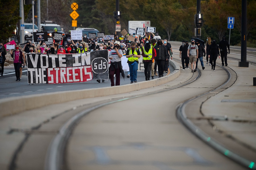 (Trent Nelson  |  The Salt Lake Tribune) Protesters march  as Vice President Mike Pence and Sen. Kamala Harris  prepare to debate at Kingsbury Hall in Salt Lake City on Wednesday, Oct. 7, 2020.