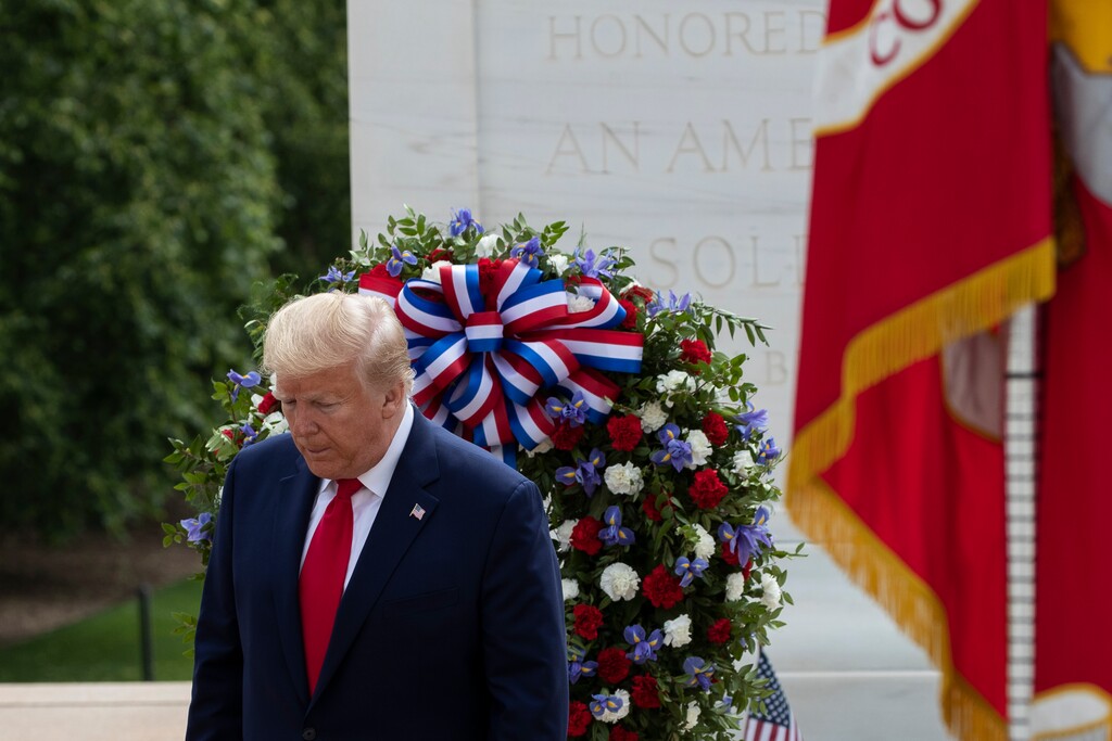 (Alex Brandon | The Associated Press) President Donald Trump turns after placing a wreath at the Tomb of the Unknown Soldier in Arlington National Cemetery, in honor of Memorial Day, Monday, May 25, 2020, in Arlington, Va.