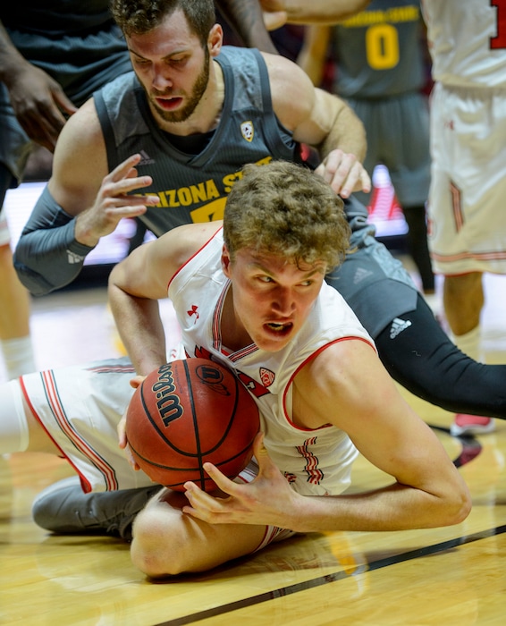 (Steve Griffin  |  The Salt Lake Tribune) Utah Utes forward Jayce Johnson (34) goes to the floor for a loose ball during the Utah Utes versus Arizona State Sun Devils at the Huntsman Center on the University of Utah campus in Salt Lake City Sunday January 7, 2018.