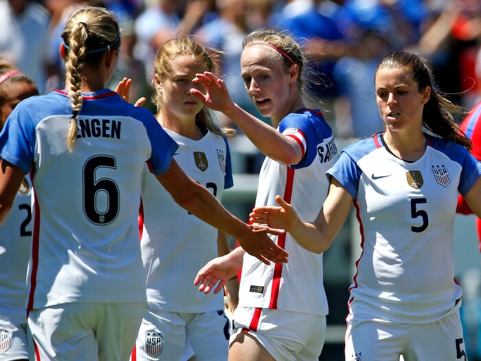 United States defender Whitney Engen, left, celebrates with fellow defenders Emily Sonnett (22), Becky Sauerbrunn (4) and Kelley O'Hare (5) after they defeated South Africa in an international friendly women's soccer match in Chicago, Saturday, July 9, 2016. (AP Photo/Nam Y. Huh)