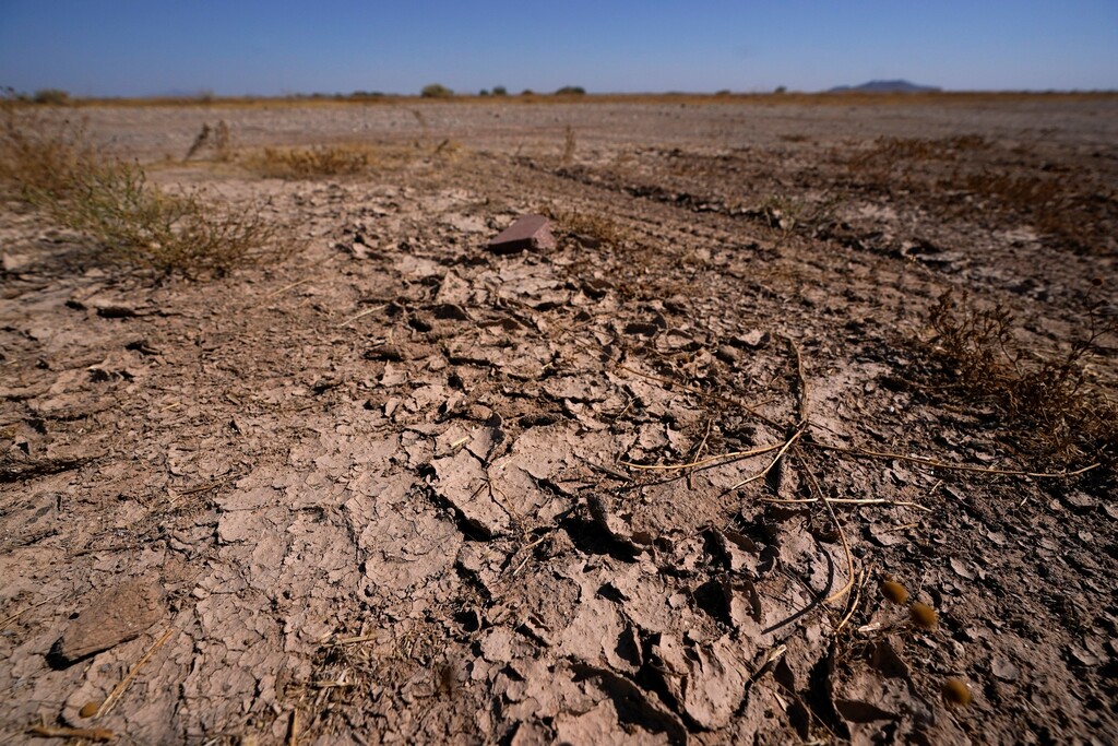 (Ross D. Franklin | AP) Dry desert soil cracks due to the lack of monsoon rainfall in Maricopa, Ariz., Wednesday, Sept. 30, 2020. In a report released on Thursday, Oct. 15, 2020, National Oceanic and Atmospheric Administration forecasters see a dry winter for all of the south from coast-to-coast and say that could worsen an already bad drought.