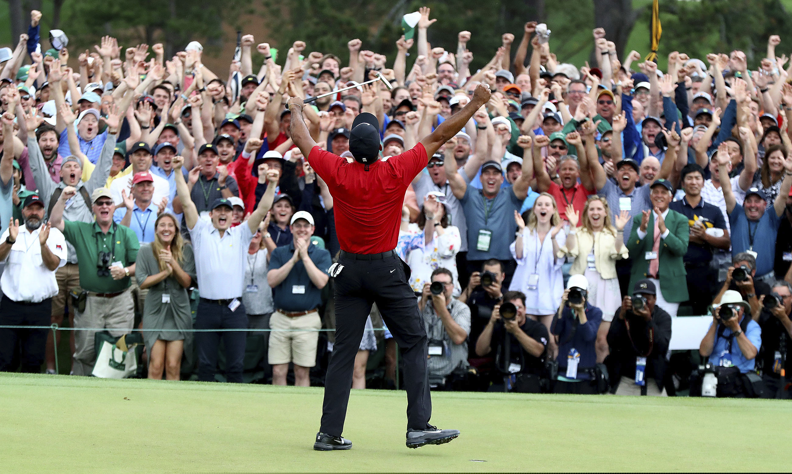 Tiger Woods reacts as he wins the Masters golf tournament Sunday, April 14, 2019, in Augusta, Ga. (Curtis Compton/Atlanta Journal-Constitution via AP)